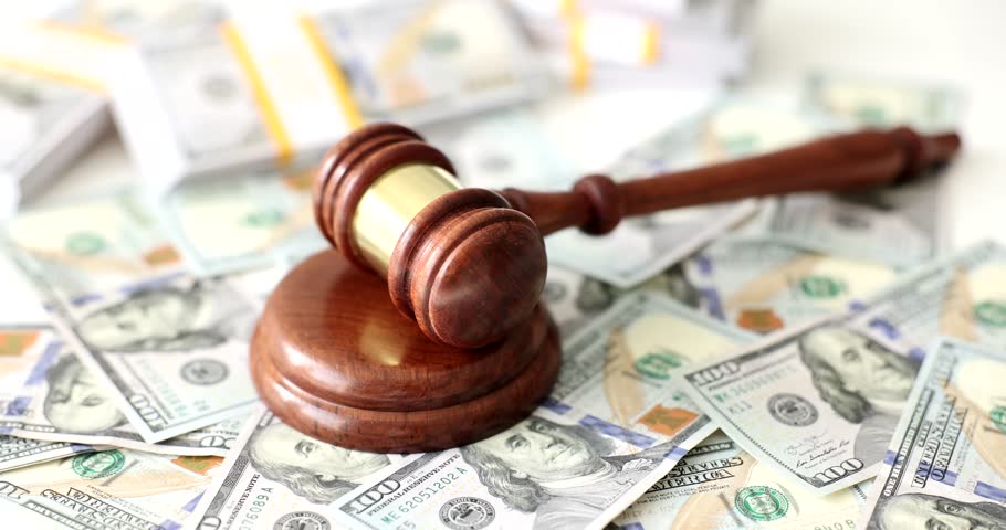 Judge gavel many of dollars for business and financial corruption. Financial crimes criminal liability Royalty-Free Stock Footage #1111595695