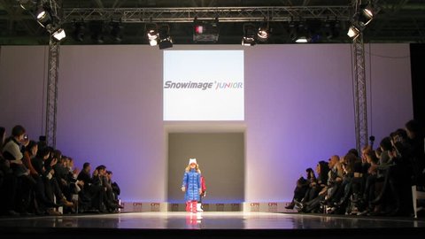MOSCOW - FEBRUARY 22: Children model new ShowImage Junior and Papolina fashion lines on catwalk at the Collection Premiere Moscow (CPM), February 22, 2011 in Moscow, Russia.  Over 1,350 brands of different segments (women's, men's, children's wear, Young  Editorial Stock Video