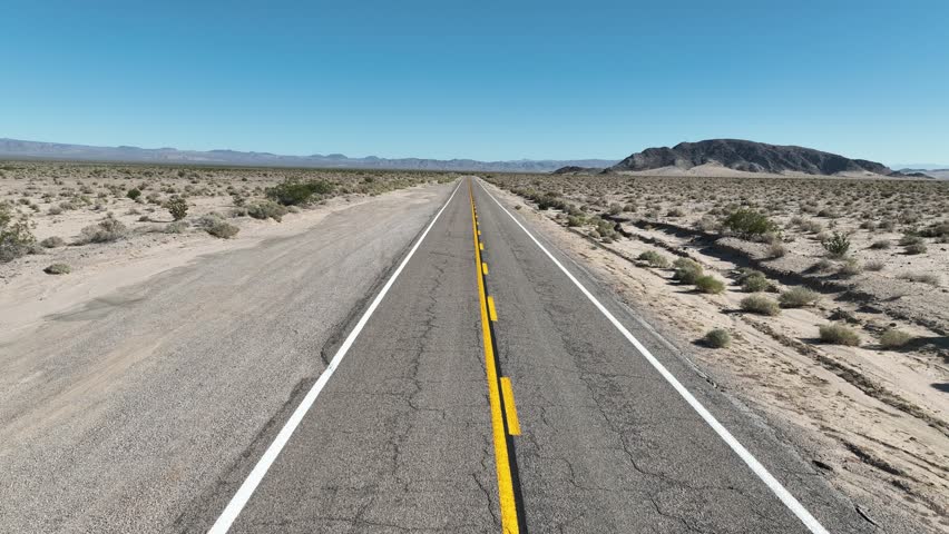Desert Road At Essex In California United States. Famous National Park Landscape. Route 66 Travel. Desert Road At Essex In California United States. California desert. California landscape.