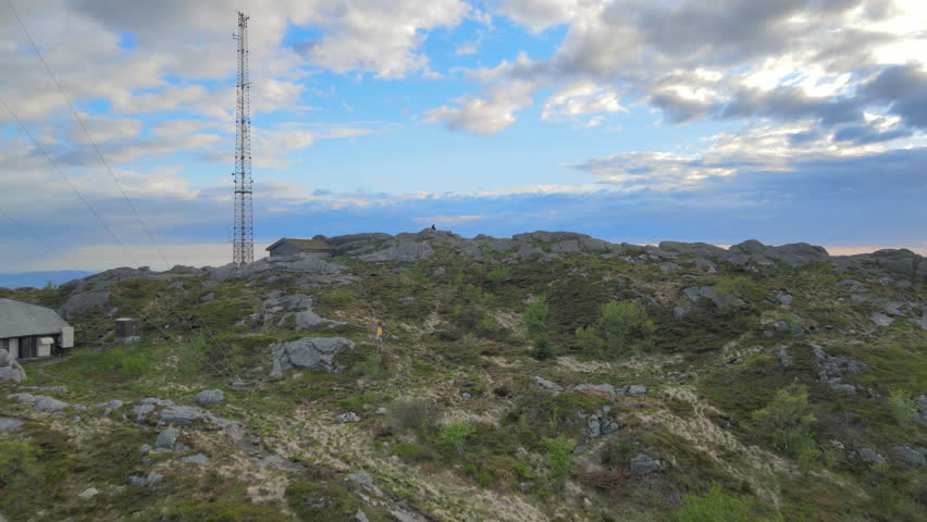 Revealing Bergen on a sunny day over Lovstakken with a man sitting