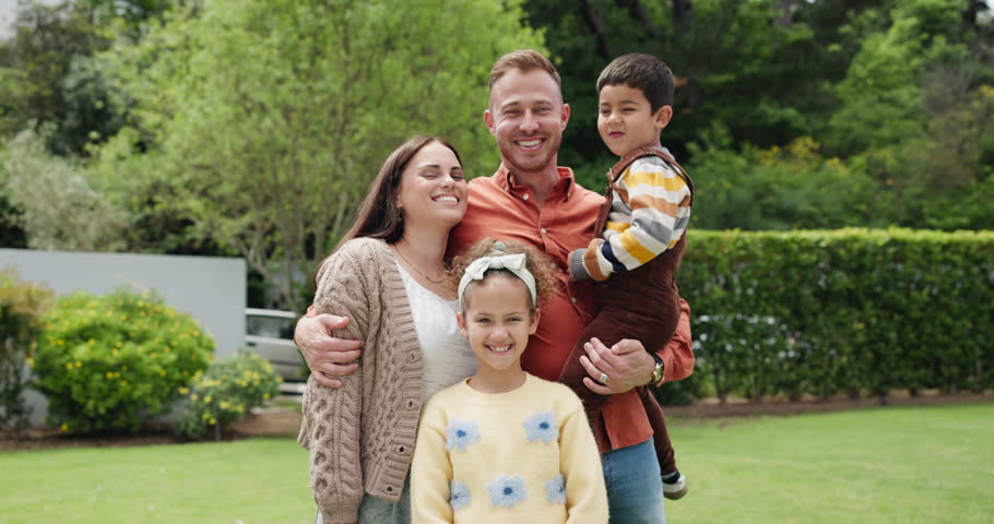 Parents, children and happy in garden, face and hug with love, bonding and outdoor in summer sunshine. Mother, father and kids with care, portrait or smile together in backyard, spring or family home