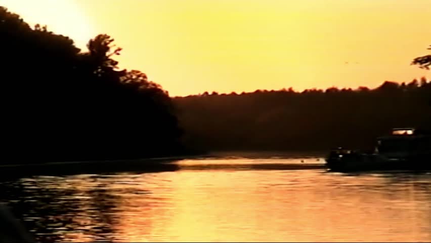 Retro VHS footage, Scan from vintage VHS-C Betacam. Retro camera 8 mm. Old film. Memories. Retro VHS Tape Effect Home Video Concept. Summer sunset memories. Walking next to river and enjoying evening