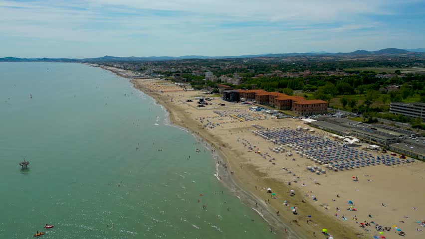 Aerial View From Flying Drone People Crowd Relaxing Beaches Italy. Summer vacation concept. Royalty-Free Stock Footage #1111618779