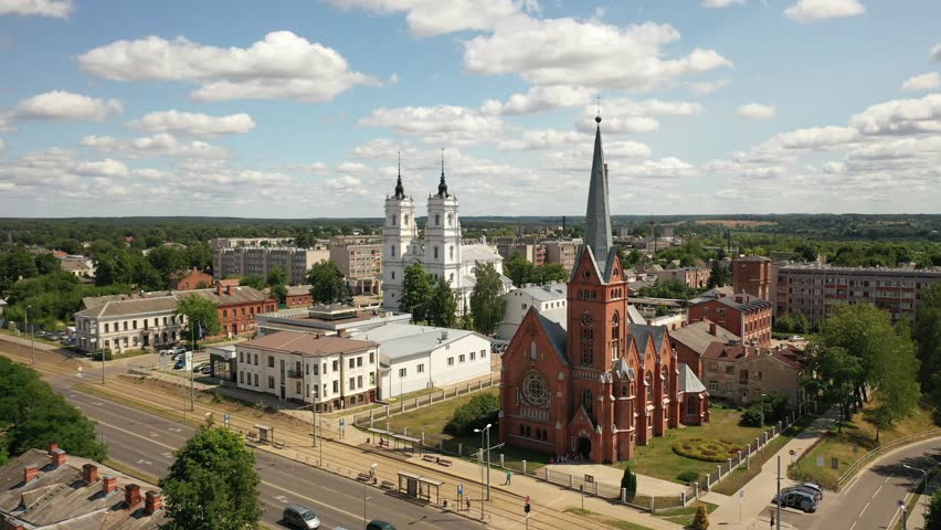 Aerial 4K video from drone to Daugavpils Martin Luther Cathedral of the Blessed Virgin Mary on a beautiful sunny summer day. Daugavpils, Latvia, Latgale, Europe

 Royalty-Free Stock Footage #1111619175