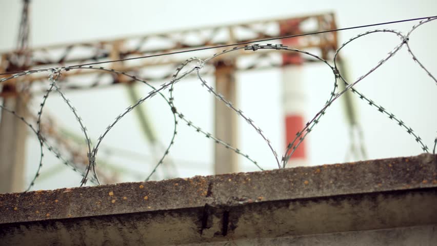 Heavily Guarded Place Prison Barbed Wire Fence. Illegal Immigration Imprisonment Restricted Area. International Border Barbwire Strict Regime. Prison Razor Wire Fence. Barbed Wire On Restricted Object | Shutterstock HD Video #1111620805