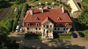 Aerial 4K video from drone to Svente (Jaunsvente) manor on a beautiful sunny summer day. Svente ,Daugavpils, Latvia, Latgale, Europe