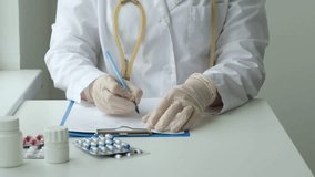 Female doctor prescribing medication in office. Physician consulting patient about pills. Healthcare, medical and pharmacy industry concept - Powered by Shutterstock - Get 15% off with code: PIKWIZARD15