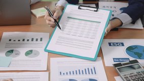 Carbon offset price report CO2 emission. Future growth Net zero waste in ESG office protect climate change global warming social issues project. Group asia woman people SDGs plan team talking workshop - Powered by Shutterstock - Get 15% off with code: PIKWIZARD15