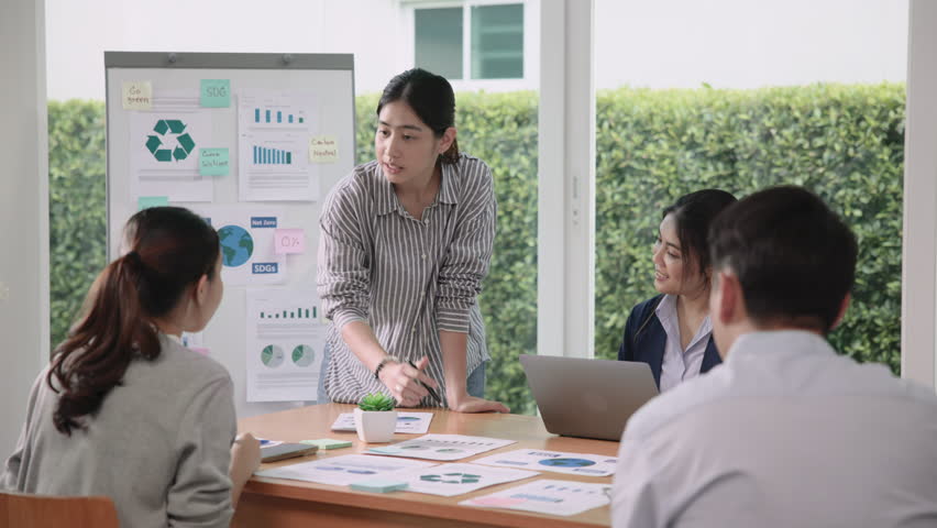 Carbon offset price report CO2 emission. Future growth Net zero waste in ESG office protect climate change global warming social issues project. Group asia woman people SDGs plan team talking workshop | Shutterstock HD Video #1111623809