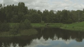 Serene Pond Aerial: Drone Flight in Stunning 4K Quality - Nature's Beauty from Above for Relaxation and Inspiration
