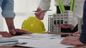Close up of hands working brainstorming and measuring for cost estimating on paperworks and floor plan drawings about design architectural and engineering for houses and buildings. - Powered by Shutterstock - Get 15% off with code: PIKWIZARD15