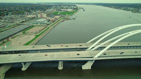 Aerial video of Mississippi river Centennial bridge and passing cars on it, USA