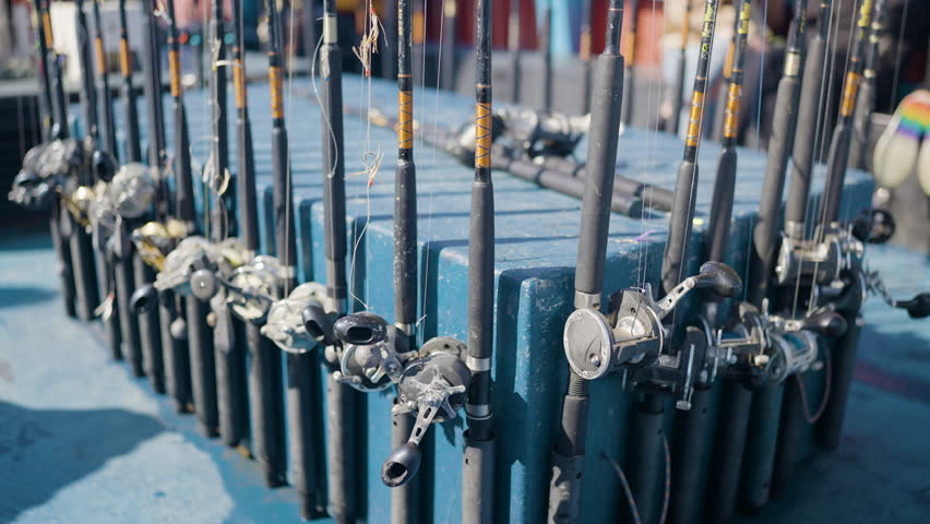 Fishing Rods Lined Up On A Tourist Boat. Footage from Devon, U.K. holiday destination for families and tourists on vacation in England.