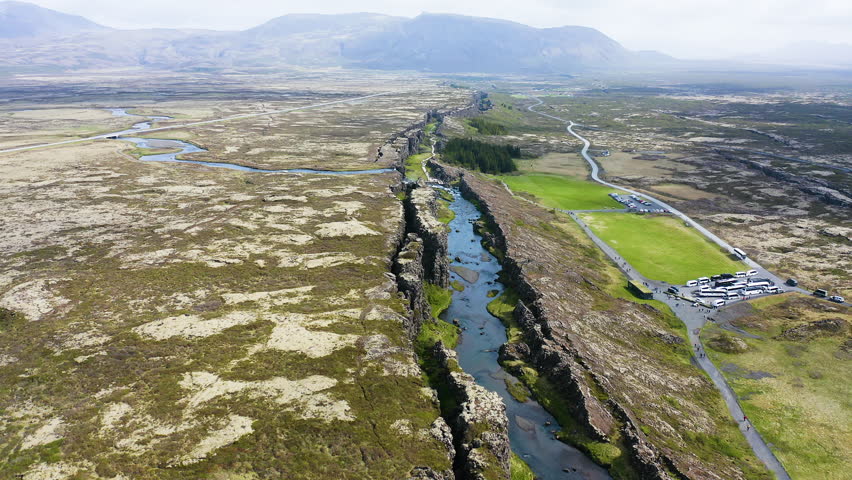 Aerial view of the beautiful Oxararfoss waterfall between tectonic plates, inside the Thingvellir National Park, Iceland.