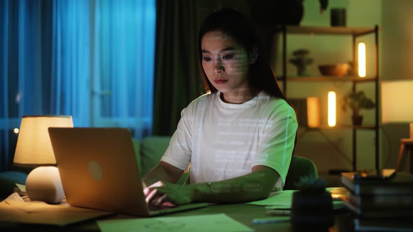 Portrait of asian Female Digital Entrepreneur Working on Computer. Line of Code Projected on His Face and Reflecting. App developer looking at hologram of machine learning data algorithm | Shutterstock HD Video #1111635083