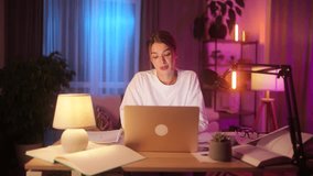 Smiling young woman influencer looking at the camera while recording video blog mobile vlog podcast live stream share experience with audience using microphone sitting at desk at home indoors - Powered by Shutterstock - Get 15% off with code: PIKWIZARD15