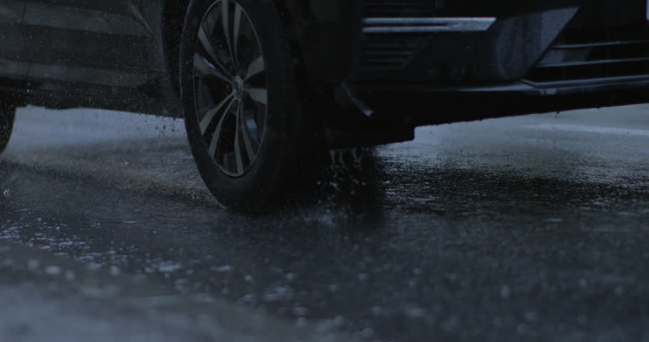 Car Tire Splashing Water on Rainy Day, 800 fps Super Slow-Motion Sidewalk Scene Royalty-Free Stock Footage #1111637861