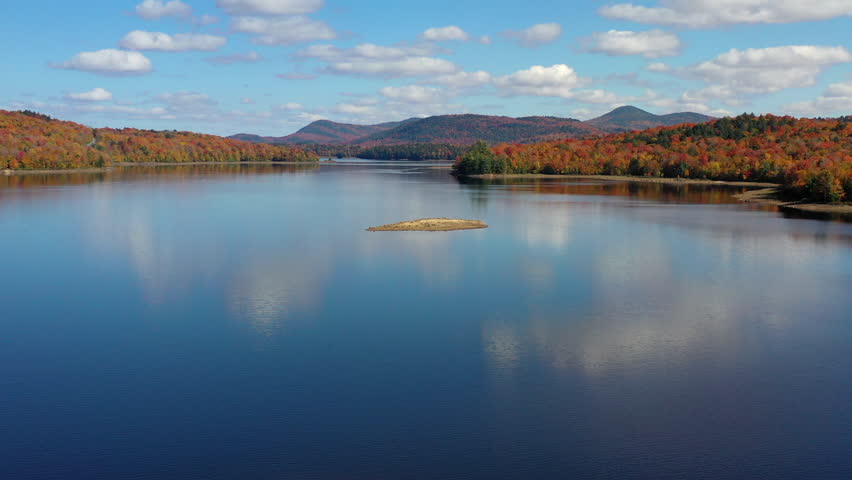 Aerial view of Fall (Autumn) foliage surrounding a lake in upstate New York.