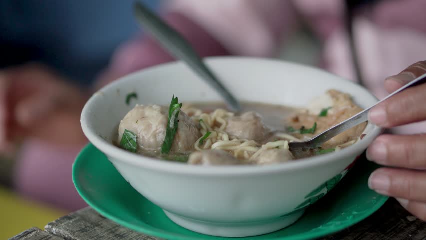 Close-up footage of Indonesia's favorite food, beef meatball noodles | Shutterstock HD Video #1111644917
