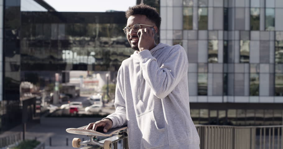 Phone call conversation, city and skateboard man speaking, talking or chat with outdoor hobby, active sports or mobile contact. Urban, relax and skater discussion, advice or consulting cellphone user