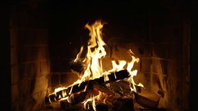 Fireplace Screen Sarver. Wood Burning in a Cozy Fireplace. Slow Motion Video of Burning Wooden Logs. A Looping Clip of Fire Flames for Meditation. Christmas time.