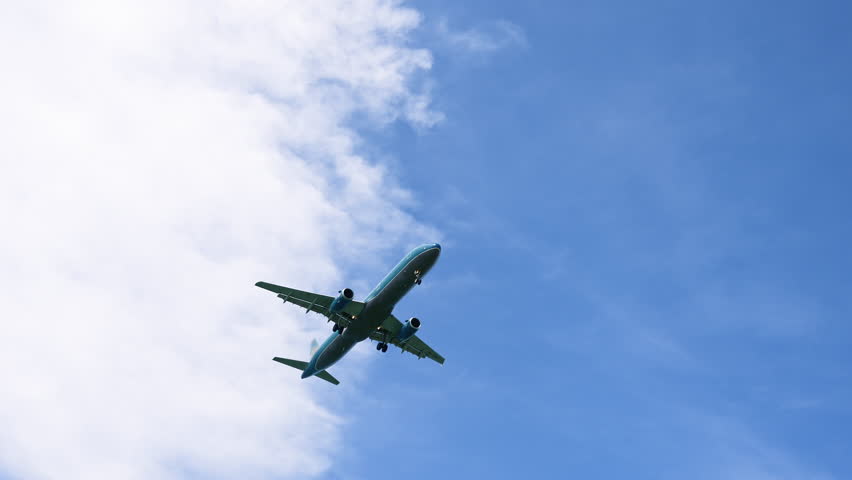 Airplane Flies in the Sky at Sunny Day. Plane With Passengers is Landing. Go Everywhere. Concept of Travel and Business | Shutterstock HD Video #1111663337