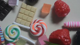 Flat lay of colorful lollipops and sweet candies