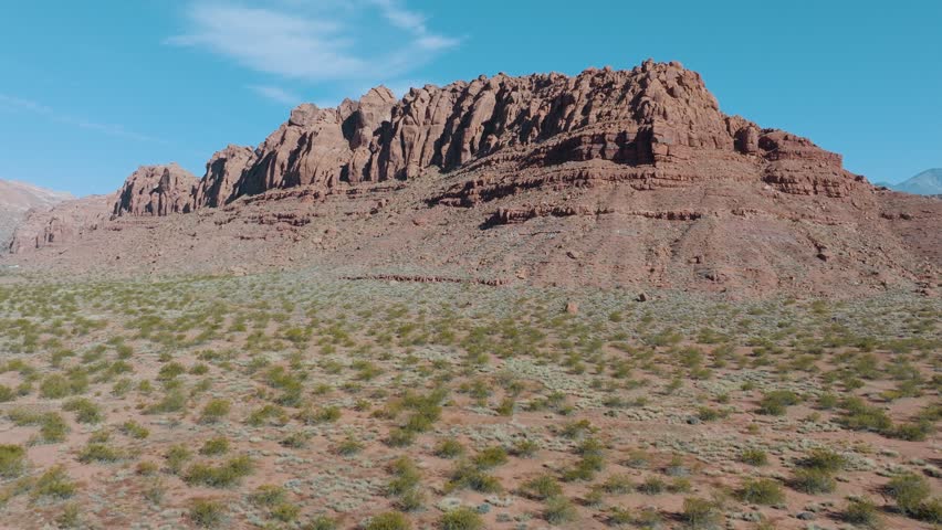 Red cliffs of southern Utah - pullback to reveal a suburb or Ivins Royalty-Free Stock Footage #1111673889