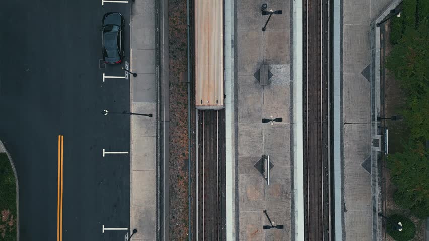 Aerial top down of train station with parking metro at railroad in Atlanta