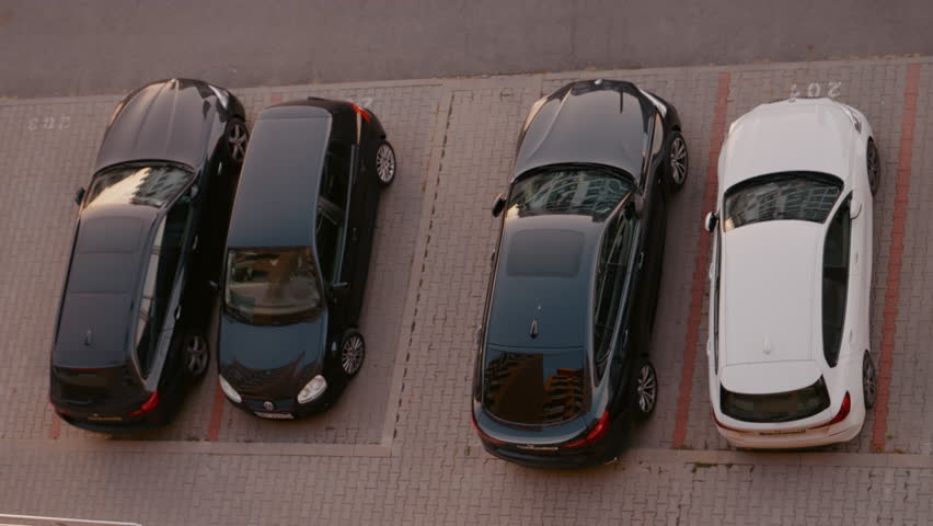Aerial top view from flat to car parking lot outside the building. Small parking area underneath block of flats. | Shutterstock HD Video #1111680823