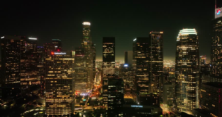 Illuminated streets downtown Los Angeles skyline at twilight dusk night. Aerial view. Los Angeles at Dusk. Aerial view of Los Angeles downtown city night skyline. LA valley California cityscape night