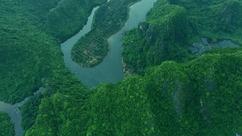 Mountains, green forest and drone for ecology, lake and hills with trees, landscape and scenery. Outdoor, nature and ecosystem in asia, peaceful and environment for sustainability and eco friendly: stockvideo