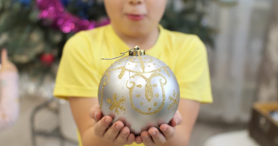 Cute boy child holding a big New Year