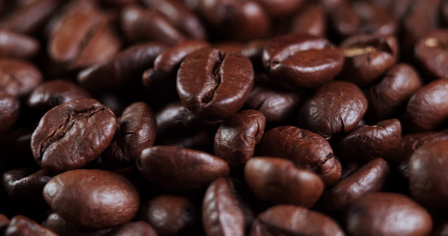 Close up of seeds of coffee. Fragrant coffee beans are roasted smoke comes from coffee beans. | Shutterstock HD Video #1111695057