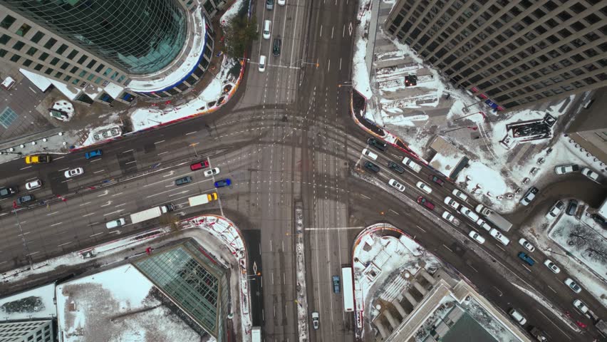 Overhead Vehicle Traffic 4K Time lapse Winter Drone Shot Canadian Roadway Trans Highway One Intersection Portage Avenue and Main Street Capital City Downtown Winnipeg Manitoba Canada