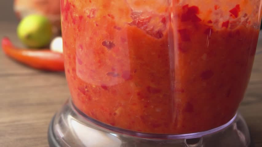 Close-up Ingredients for making hot chili sauce whipped in a blender. High quality FullHD footage