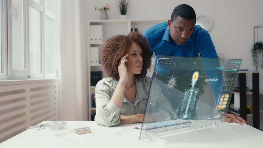 Two lab scientists working on a virus infection simulation using futuristic tech | Shutterstock HD Video #1111712251