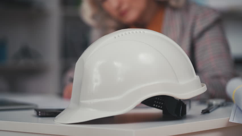 Close-up of thoughtful woman architect planning a building in business office | Shutterstock HD Video #1111712321