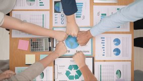 Save the earth planet climate change social ESG office net zero waste unity stack hand fist bump circle trust go green team huddle. Group SDGs goals people CO2 credit carbon offset control support - Powered by Shutterstock - Get 15% off with code: PIKWIZARD15