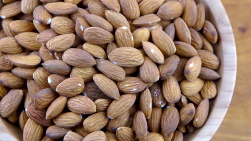 Almond kernel in a bowl. Background view from above. Healthy food | Shutterstock HD Video #1111713091