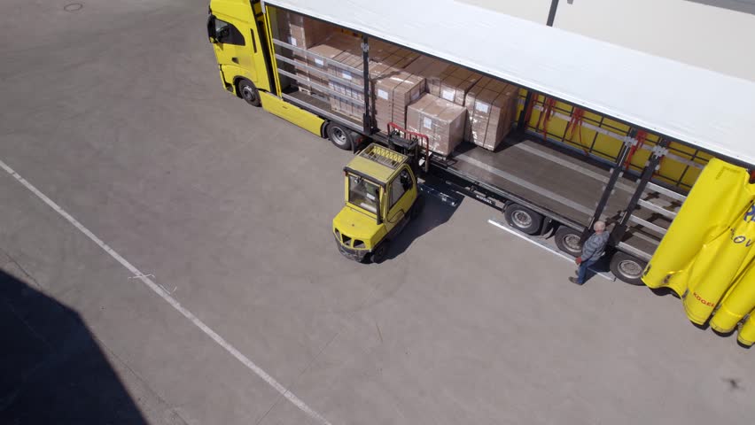 Aerial video of forklift loads a truck | Shutterstock HD Video #1111714385