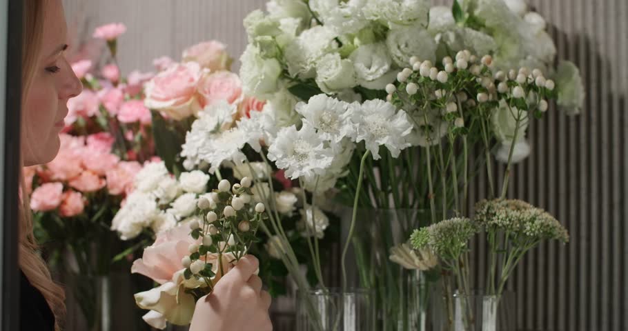 Woman choose flowers for composition | Shutterstock HD Video #1111715643