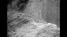Deep castle fortification moat building. Historic castle. Tourism by stone medieval landmark stronghold. Ancient fort landscape, side view. Archival black white film. Retro archive. 1980s Crimea