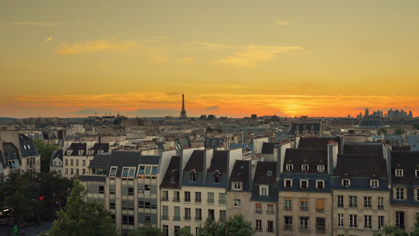 Orange dawn over the city of Paris against the background of the roofs of houses | Shutterstock HD Video #1111722629
