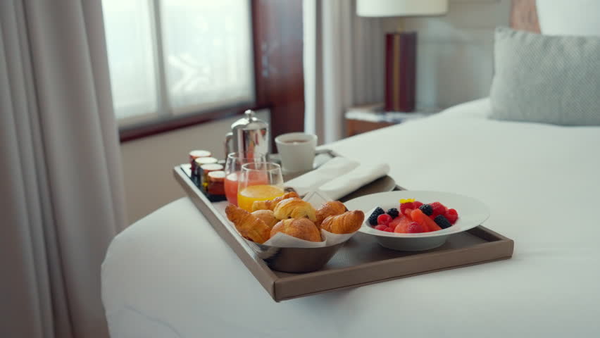 Breakfast on a tray in a hotel room in the morning | Shutterstock HD Video #1111722645