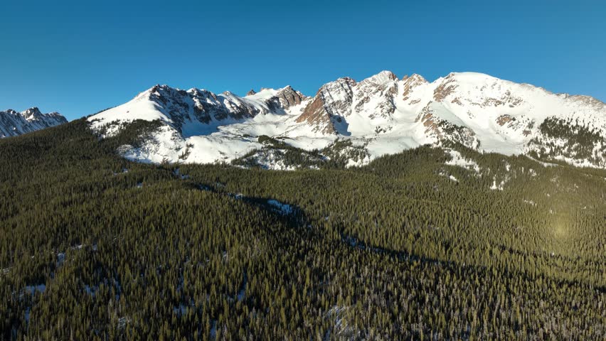 Aerial shot of the snow covered Rocky Mountains in Colorado.