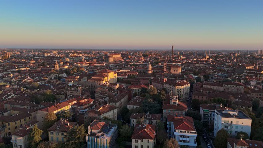 Aerial morning shot of Bologna, Italy. Flying above red tiled roofs of the old town in Bologna Royalty-Free Stock Footage #1111726459