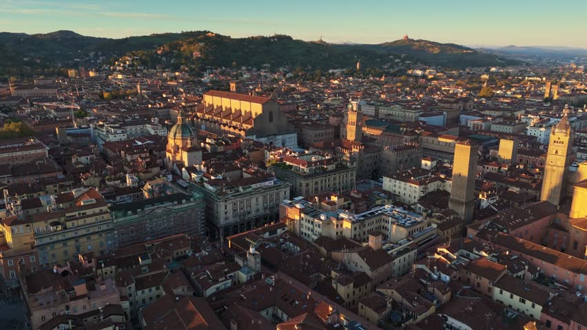 Flying over Palazzo del Podesta in Bologna, Italy. Aerial morning shot at sunrise of Bologna city centre. UHD, 4K, high quality shot Royalty-Free Stock Footage #1111726463