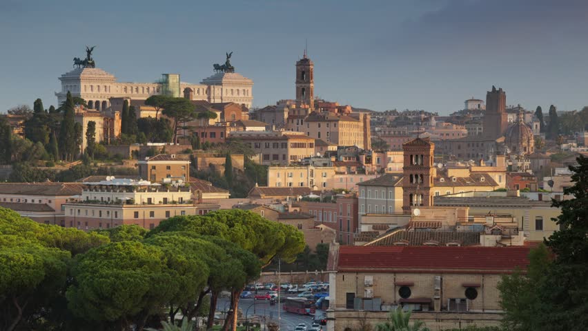 Panning shot of morning Rome, Italy. Sunrise view from Terrazza Belvedere Aventino in Rome. Altare della Patria, old houses and churches | Shutterstock HD Video #1111726477