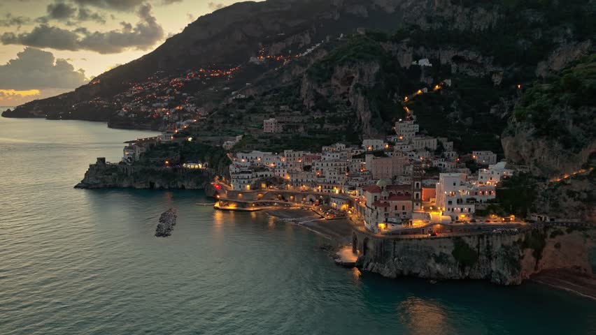 Flying above famous Amalfi Coast after sunset. Small beautiful coastal towns - Atrani and Amalfi with city lights. Amalfi coast near Naples, Campagna, Italy. High quality 4k | Shutterstock HD Video #1111726479